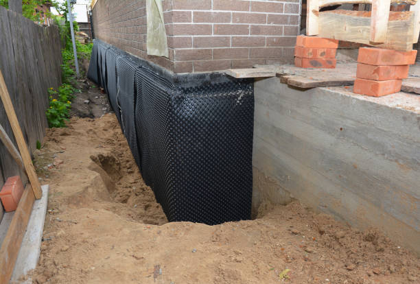 SJ Waterproofing Pros technician performing targeted Exterior Waterproofing assessment in Freetown, IN